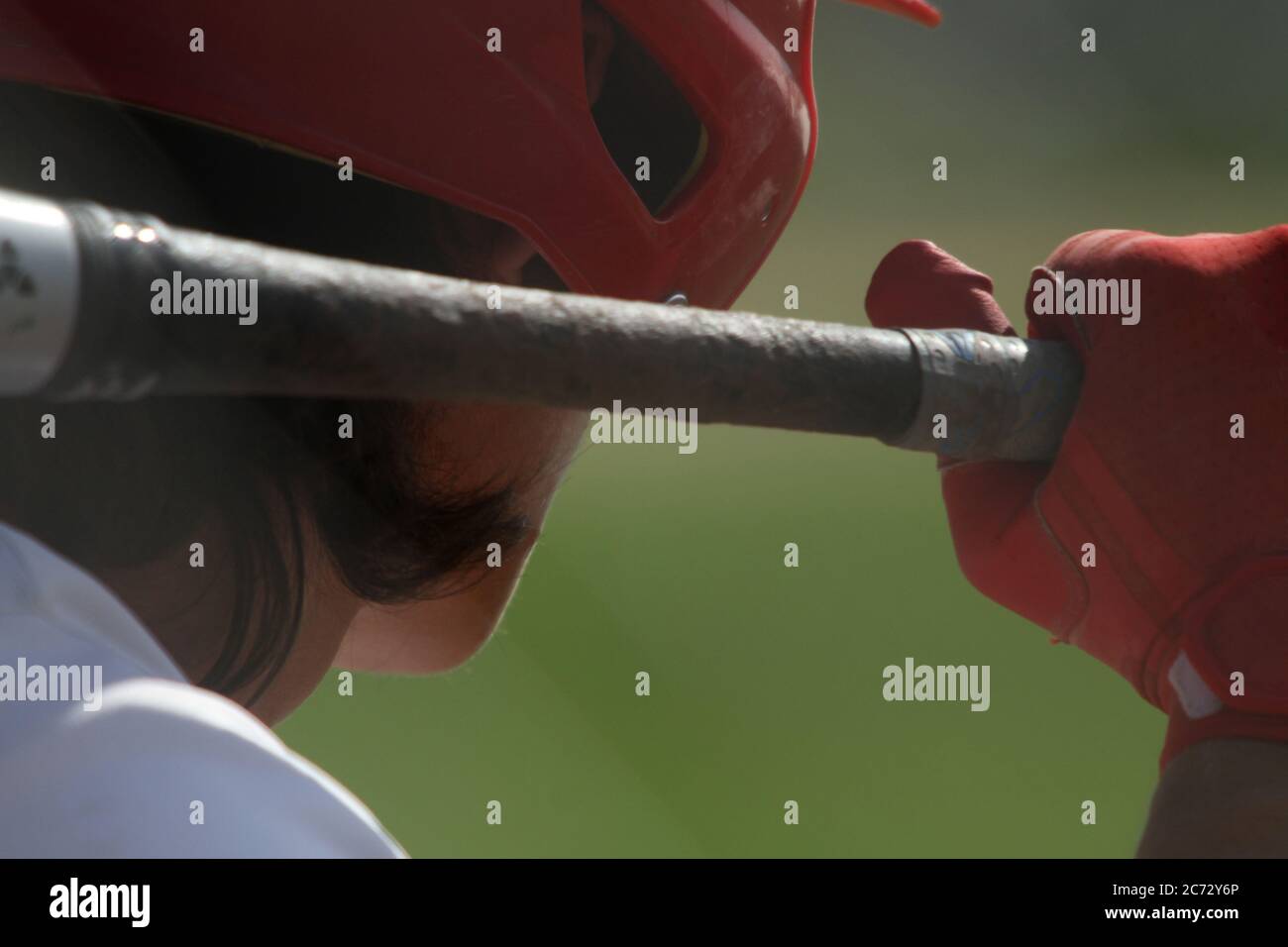 Close-up of a baseball batter looking out at the pitcher. Stock Photo
