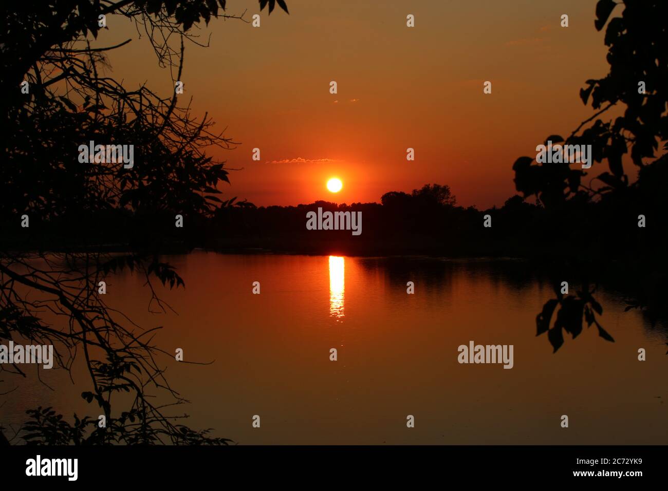 A great sunset with a lake view Stock Photo