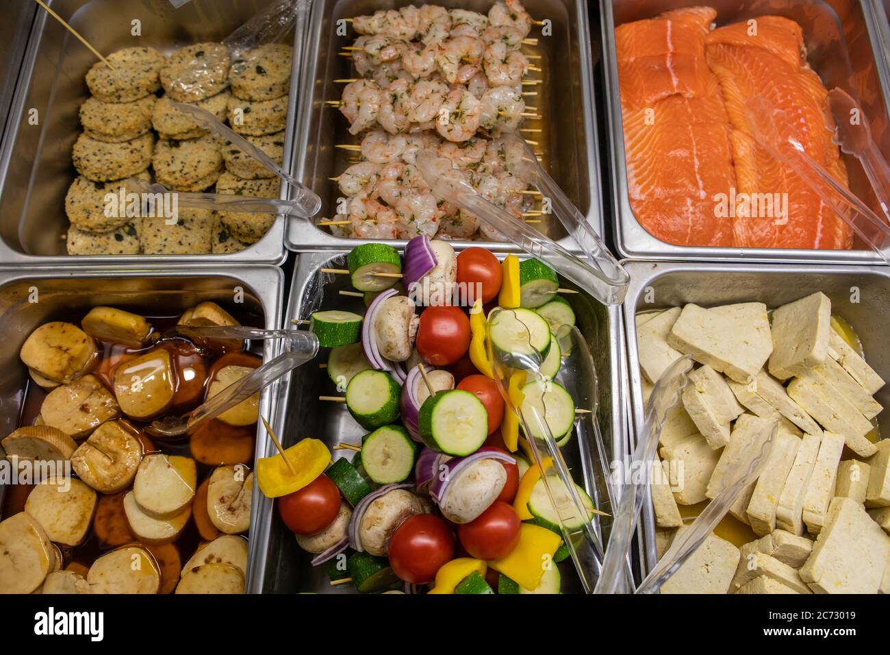 Variety Of Fresh Skewers And Meat Products On The Butcher Display Refrigerator In The Supermarket Salmon Shrimps Tofu And Vegetarian Patties In Top View Stock Photo Alamy