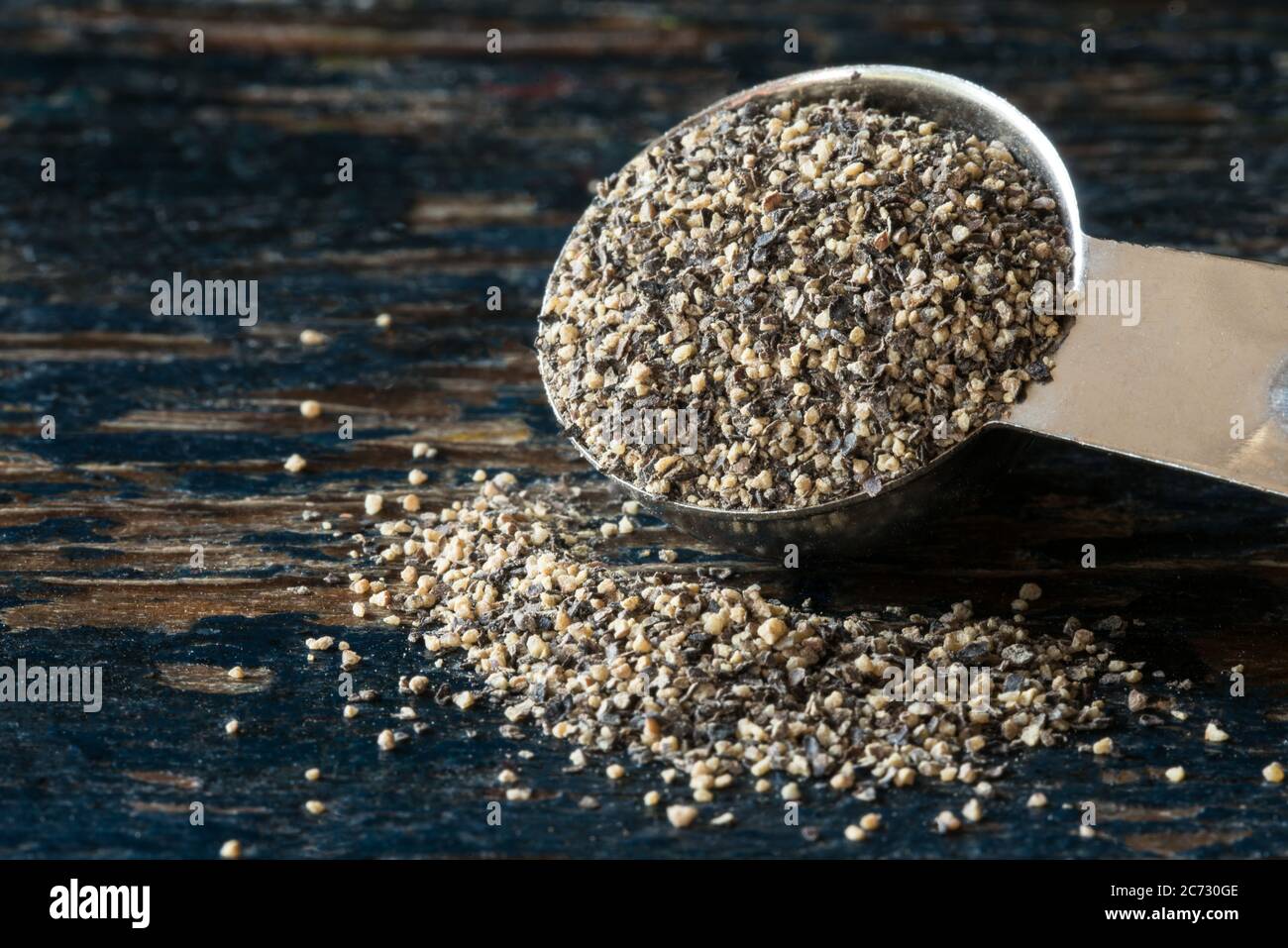 Ground Black Pepper Spilled from a Teaspoon Stock Photo Alamy