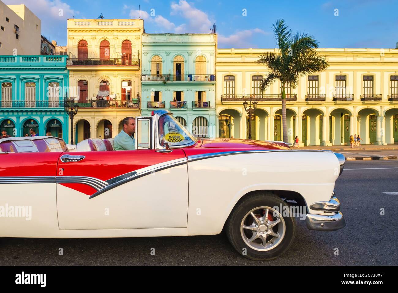 Classic convertible  car and colorful buildings in downtown Havana Stock Photo