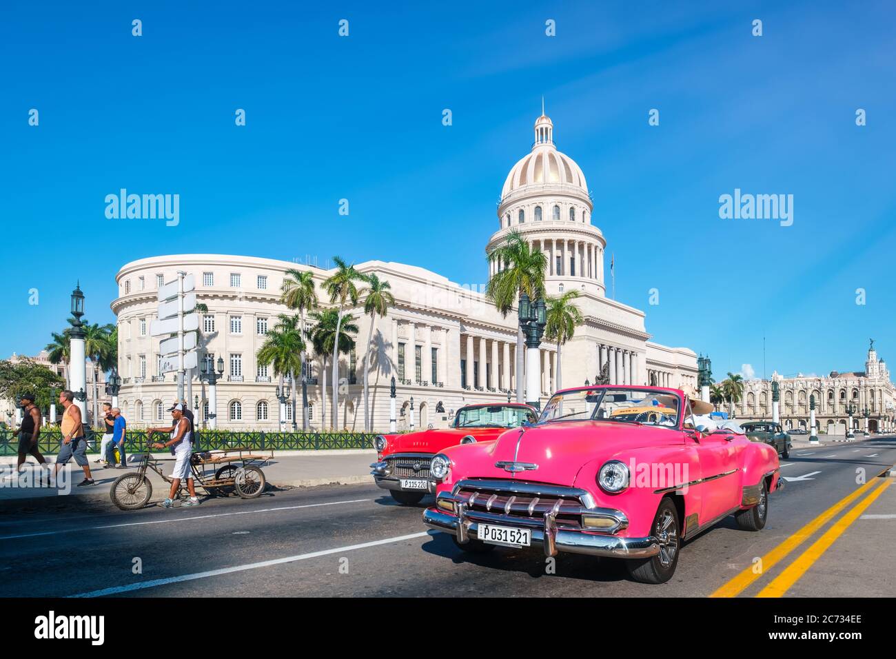Street scene in Old Havana with classic convertible cars and the famous ...