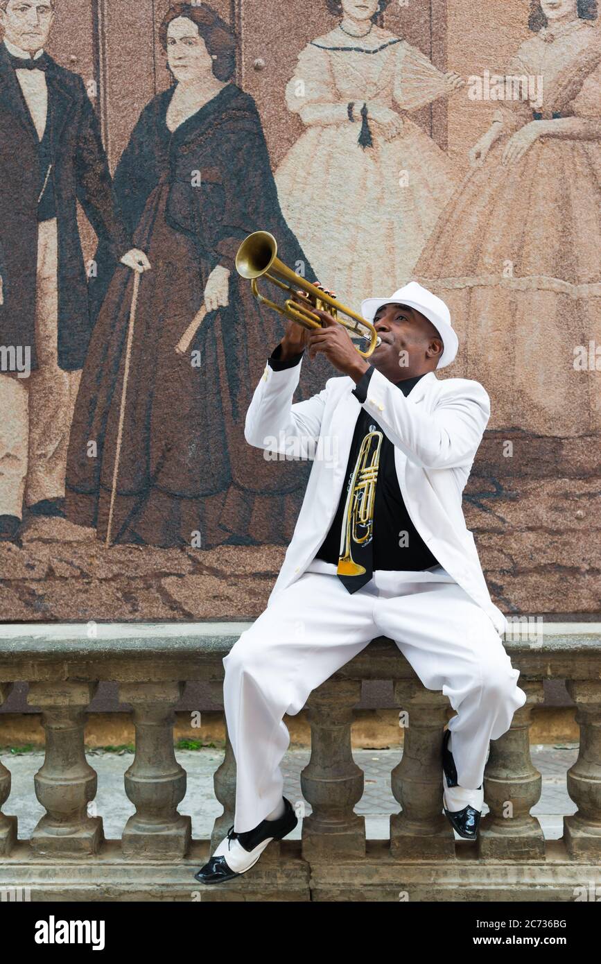 Black cuban musician playing the trumpet in Havana Stock Photo