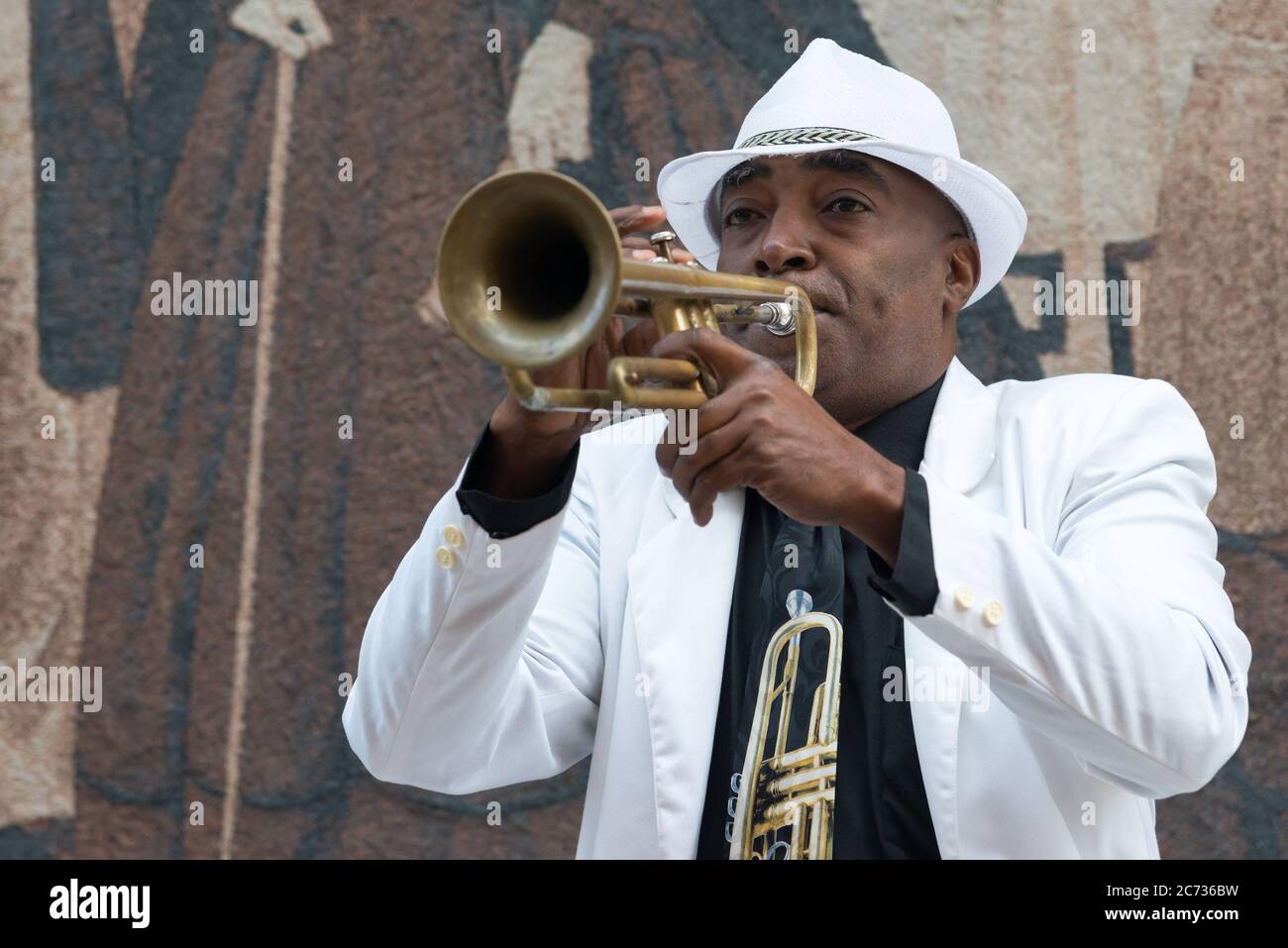 Black cuban musician playing the trumpet in Havana Stock Photo