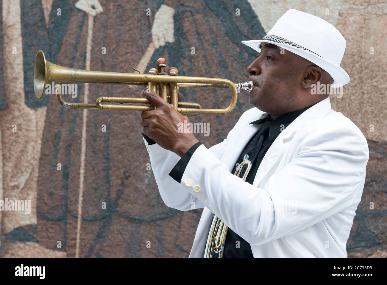Black cuban musician playing the trumpet in Havana Stock Photo