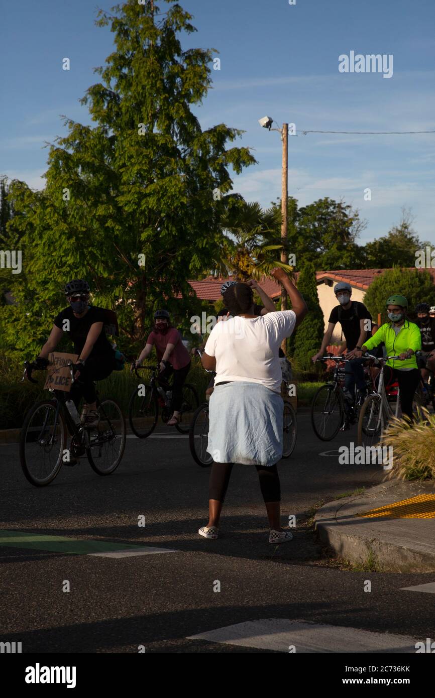 Portland, Oregon, USA - June 10th, 2020: Hundreds of cycling rode through Northeast Portland to participate in the Black Lives Matter movement taking Stock Photo