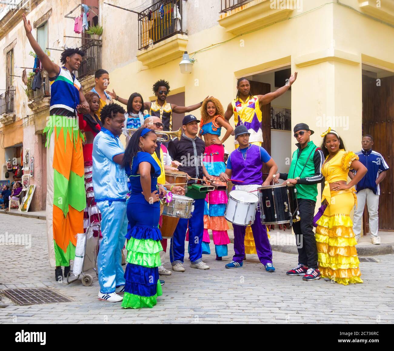 Colorful band of musicians and dancers in Old Havana Stock Photo