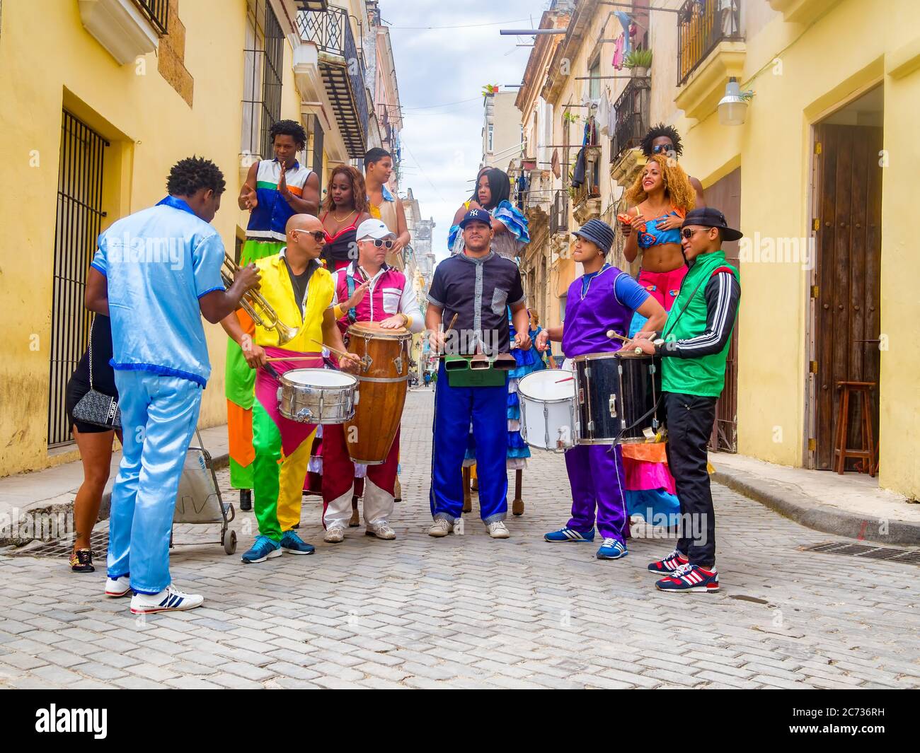 Colorful band of musicians and dancers in Old Havana Stock Photo