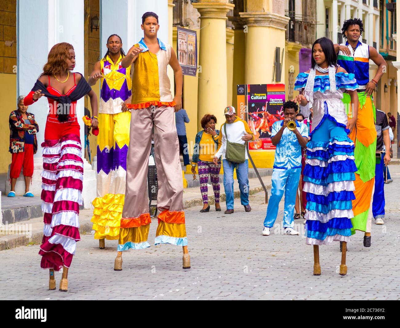 Colorful band of musicians and dancers in Old Havana Stock Photo