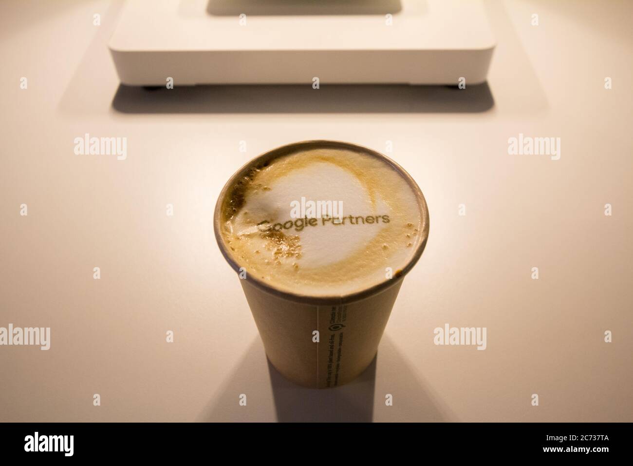 BUCHAREST, ROMANIA - FEBRUARY 12, 2020: Google Partners logo printed on a coffee. Google Partners is the agreement between Google and some marketing a Stock Photo