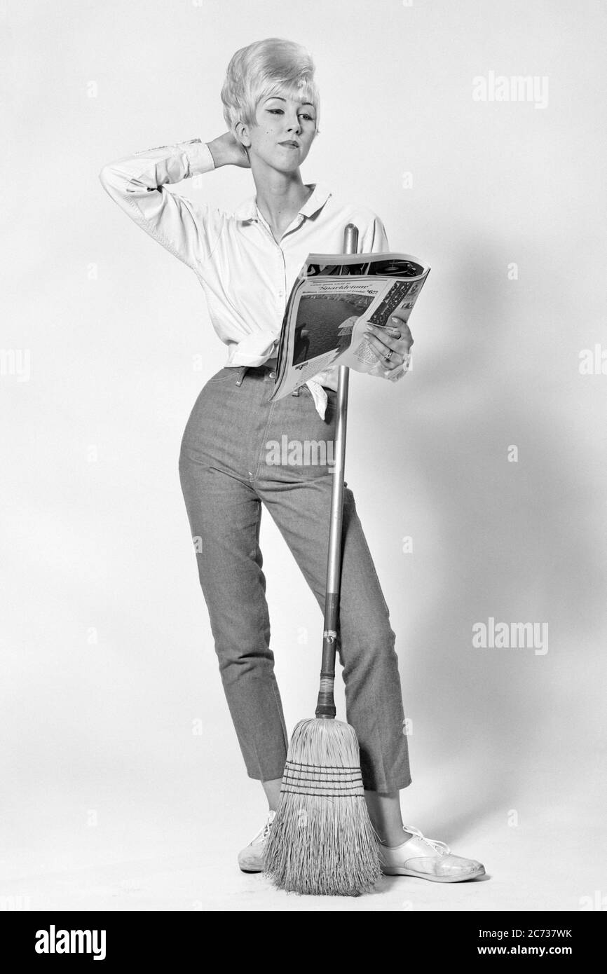 1960s BLONDE WOMAN BOUFFANT HAIRDO HOLDING BROOM POSING HAND BEHIND HEAD READING FASHION MAGAZINE INSTEAD OF SWEEPING CLEANING - asp jo7394 ASP001 HARS COMIC SEXY INFORMATION COTTON JOY LIFESTYLE FEMALES STUDIO SHOT HEALTHINESS HOME LIFE COPY SPACE FULL-LENGTH LADIES PERSONS DOING INSPIRATION BROOM CONFIDENCE DENIM B&W BEEHIVE GOALS HOMEMAKER DREAMS HUMOROUS LAZY HOMEMAKERS STYLES SWEEPING COMICAL PRIDE OPPORTUNITY BLOUSE HOUSEWIVES POSING CONNECTION COMEDY ESCAPE IMAGINATION STYLISH SUPPORT BLUE JEANS DISTRACTED FASHIONS HAIRDO INFORMAL INSTEAD MID-ADULT MID-ADULT WOMAN MIDRIFF SWEEP TEASED Stock Photo