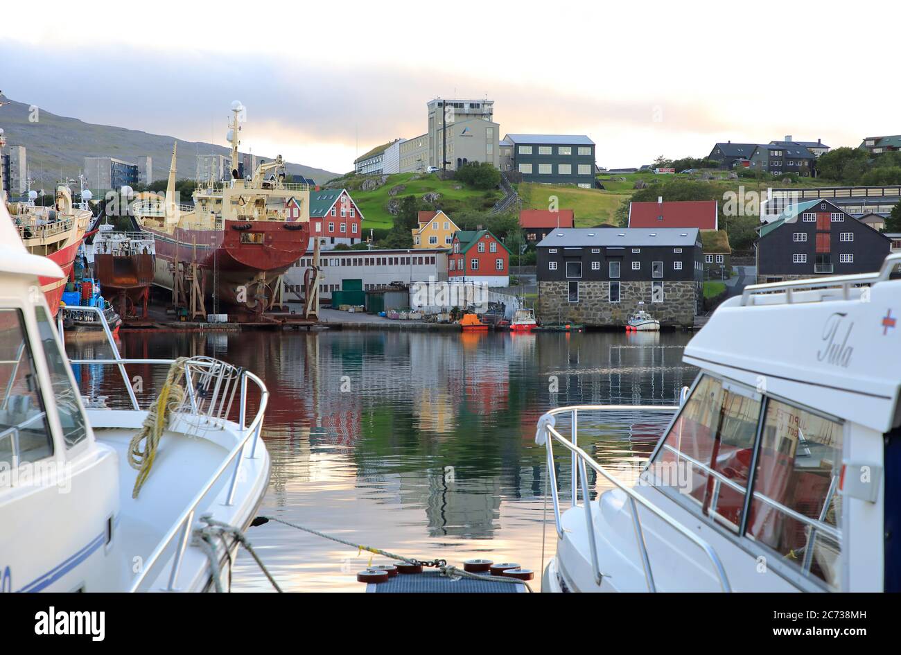 Motorboats docking in Torshavn Harbor.Torshavn.Streymoy.Faroe Islands.Territory of Denmark Stock Photo