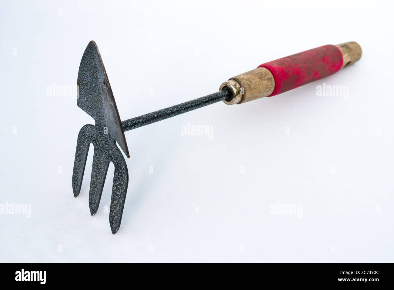 Handheld combination rake and trowel hires stock photography and