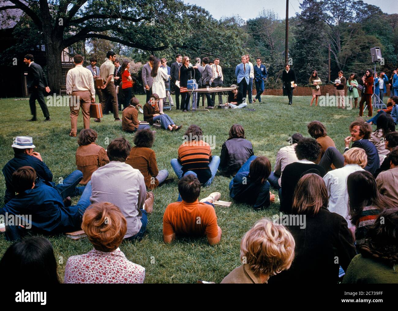 1970s PEACEFUL CAMPUS PROTEST DEMONSTRATION TEACH-IN STUDENTS STANDING SITTING ON LAWN SPEAKING ON AN ISSUE LONG ISLAND NY USA - ks6708 KRU001 HARS YOUNG ADULT PEACE BALANCE SAFETY TEAMWORK COMPETITION INFORMATION PROTEST LIFESTYLE CAMPUS CELEBRATION FEMALES UNITED STATES COPY SPACE FULL-LENGTH LADIES PERSONS INSPIRATION UNITED STATES OF AMERICA CARING MALES RISK TEENAGE GIRL TEENAGE BOY NY SPIRITUALITY SADNESS NORTH AMERICA FREEDOM GOALS NORTH AMERICAN WIDE ANGLE DISCOVERY UNIVERSITIES COURAGE CHOICE KNOWLEDGE LEADERSHIP POWERFUL PROGRESS AN ON AUTHORITY DEMONSTRATION PEACEFUL POLITICS Stock Photo