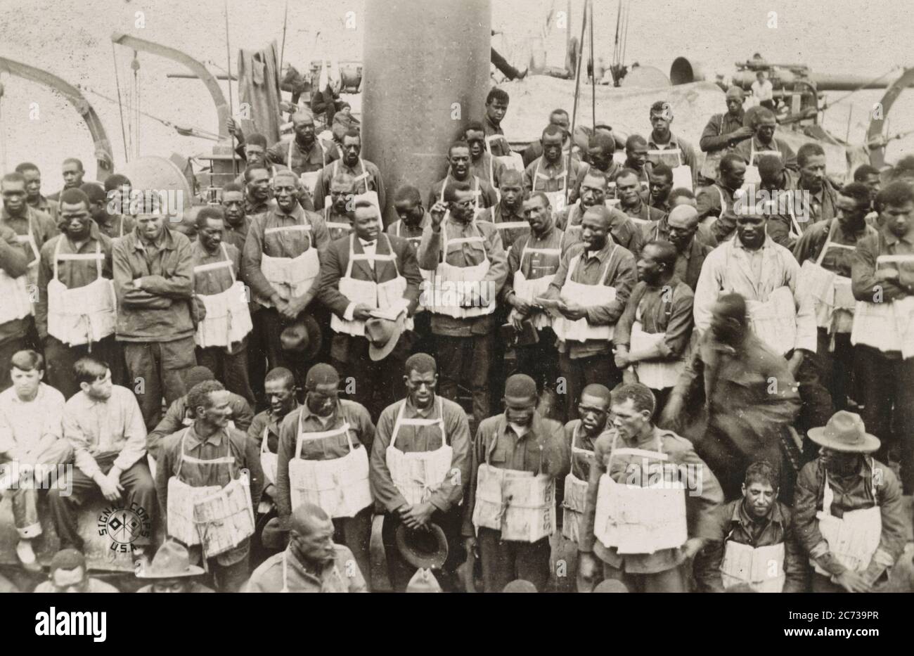 On board the 'Momus' at sea, in the danger zone Part of the civilian stevedore battalion, under command of captain Goege Luberoff, Q.M.C., on board the Momus in the danger zone, on their way to Saint Nazaire, France. June 1917 Stock Photo