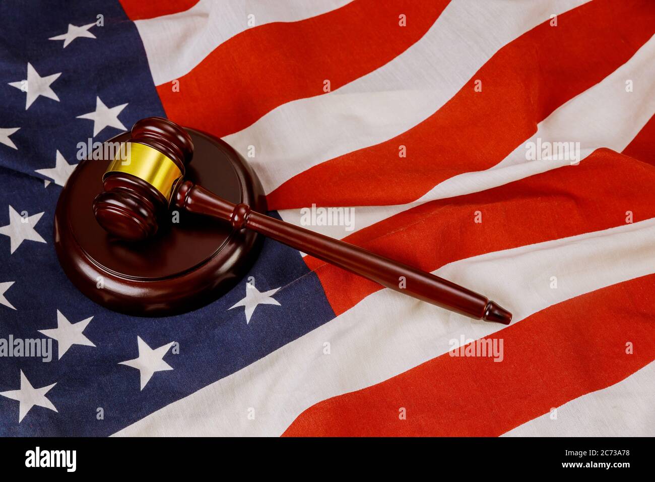 USA lawyers in the wooden judge hammer on american flag of office Justice and law Stock Photo