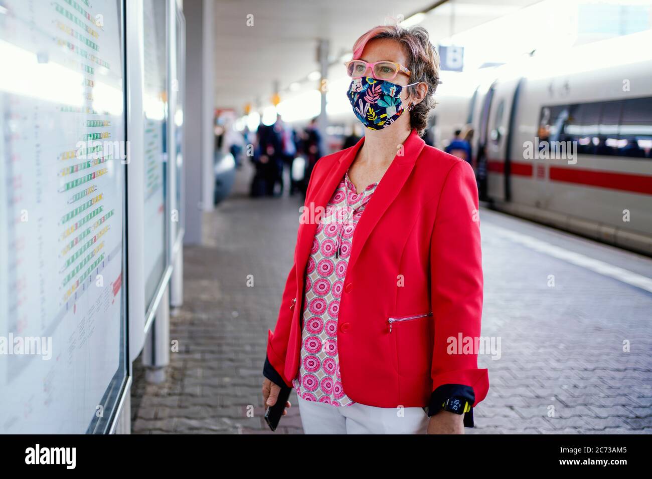 Mannheim, Germany. 09th July, 2020. Andrea Kadenbach, head of Mannheim station management, looks at a car position indicator on a platform in the main station. (to dpa: 'Only station manager rules over 146 stops') Credit: Uwe Anspach/dpa/Alamy Live News Stock Photo