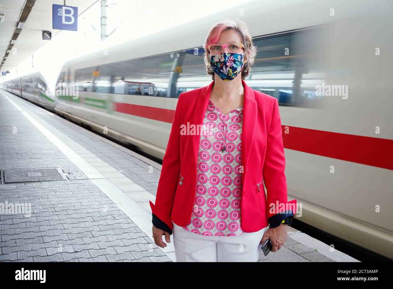 Mannheim, Germany. 09th July, 2020. Andrea Kadenbach, head of station management Mannheim, is standing in front of an arriving train on a platform in the main station. (to dpa: 'Only station manager rules over 146 stops') Credit: Uwe Anspach/dpa/Alamy Live News Stock Photo
