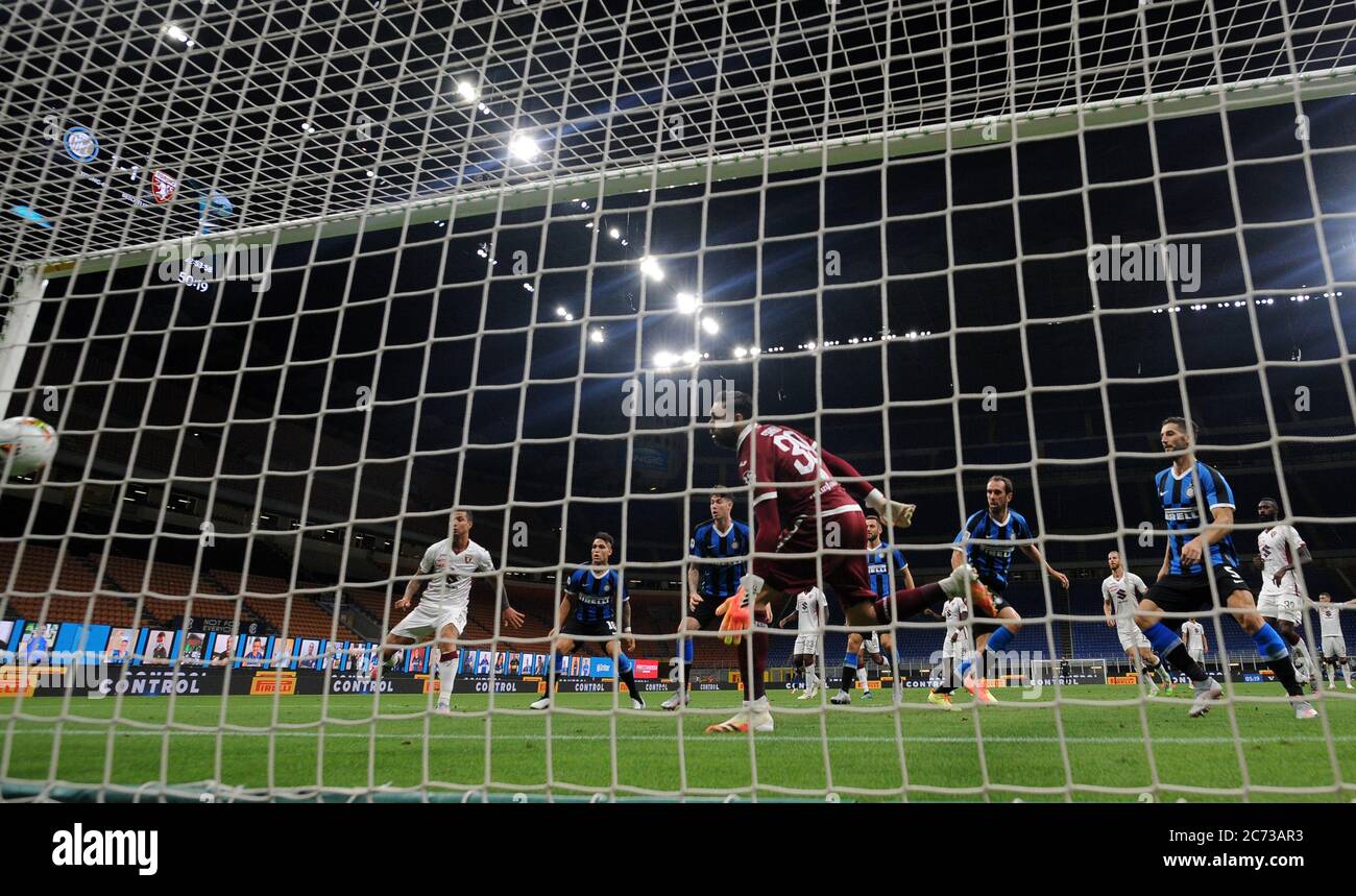 Milan, Italy. 13th July, 2020. FC Inter's Diego Godin (5th R) scores during an Italian Serie A football match between FC Inter and Torino in Milan, Italy, July 13, 2020. Credit: Alberto Lingria/Xinhua/Alamy Live News Stock Photo