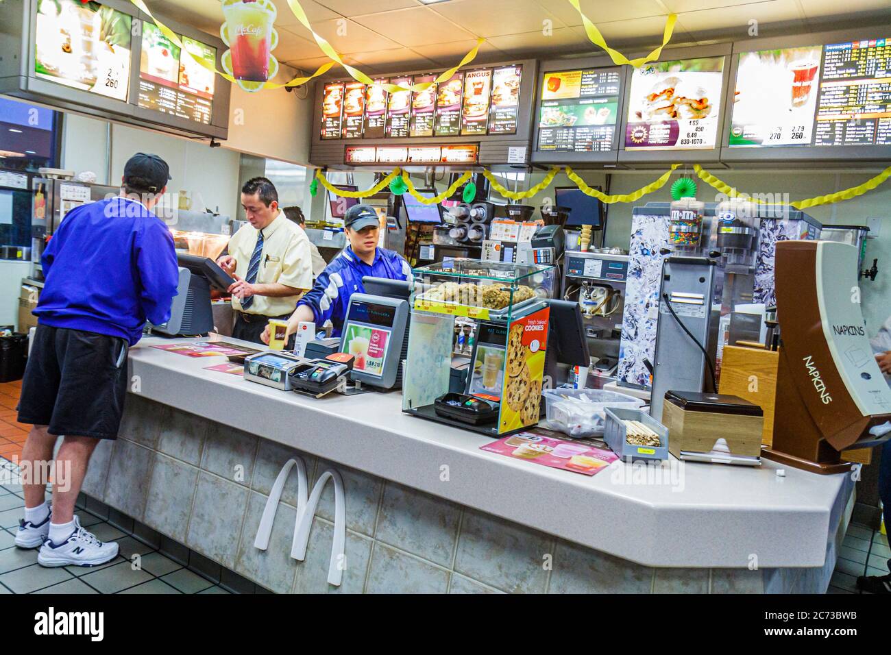 Mcdonalds restaurant fast food counter asian man male hires stock photography and images Alamy