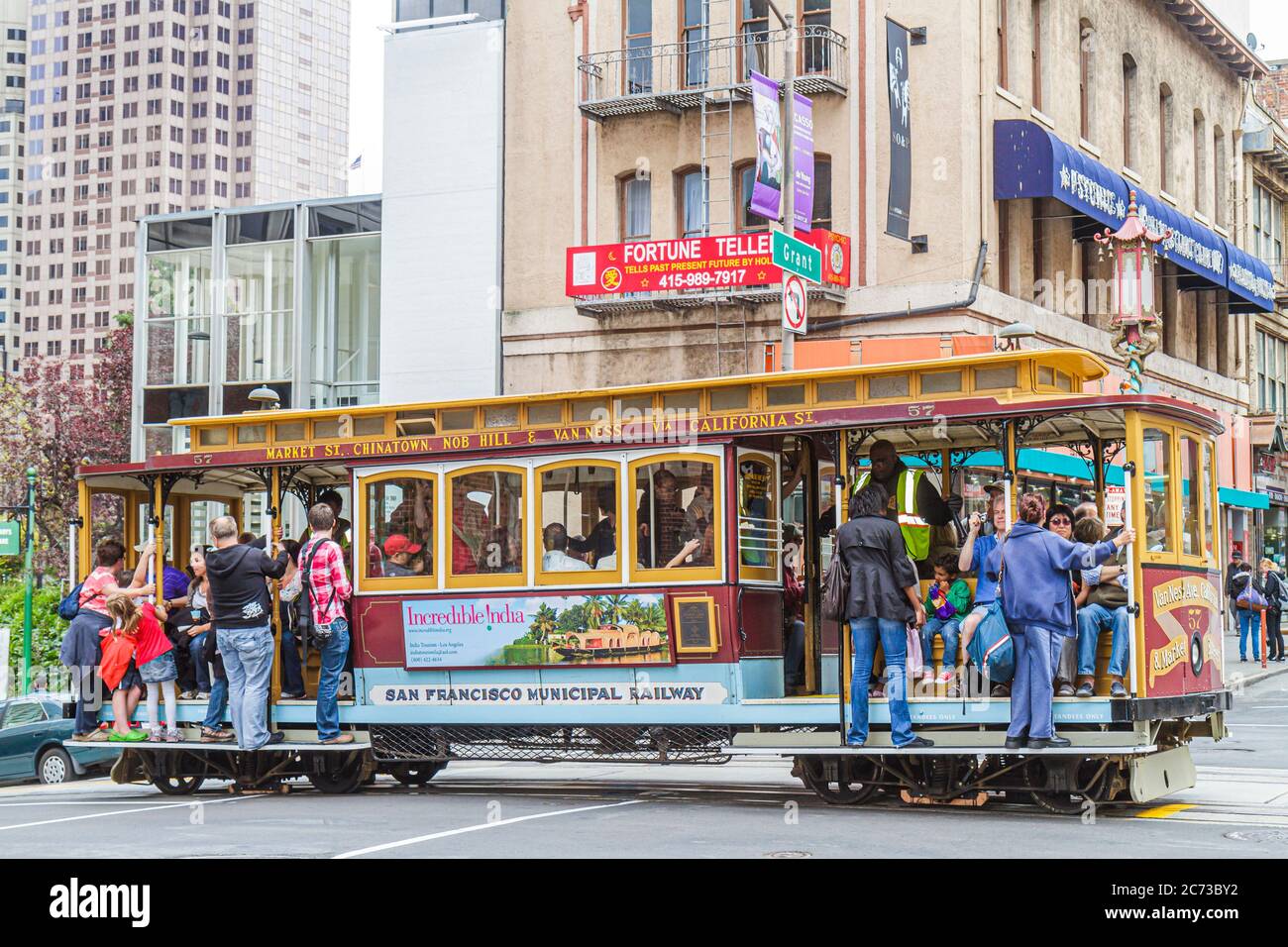 San Francisco California,Chinatown,Grant Street,transit system,cable car cars,passenger passengers rider riders,outside exterior front,entrance,holdin Stock Photo