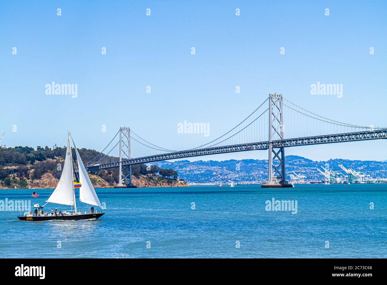 San Francisco California,The Embarcadero,Ferry Plaza,view,San Francisco Bay,Oakland Bay Bridge,Yerba Buena Island,sailboat,sailing,water,CA110717022 Stock Photo