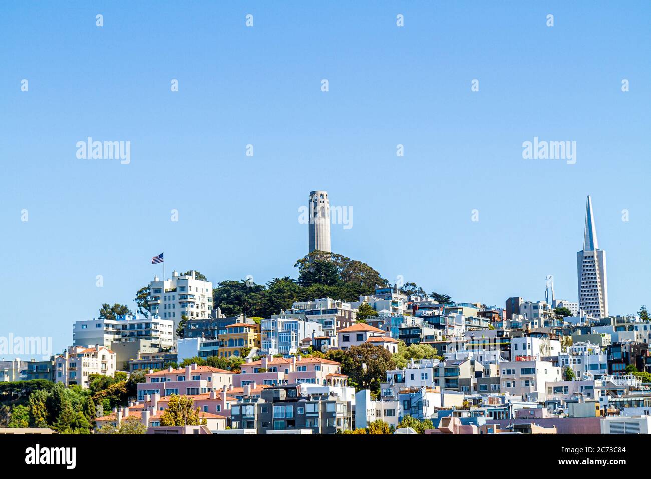 San Francisco California,Telegraph Hill neighborhood,Coit Tower,skylineart deco,building,clear blue sky,Arthur Brown,Henry Howard,TransAmerica Pyramid Stock Photo