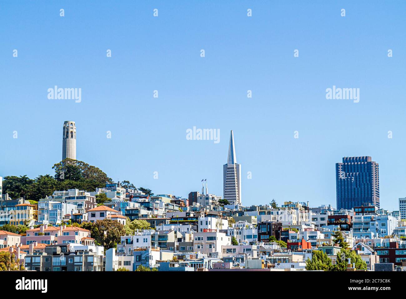 San Francisco California,Telegraph Hill neighborhood,Coit Tower,skylineart deco,building,clear blue sky,Arthur Brown,Henry Howard,TransAmerica Pyramid Stock Photo