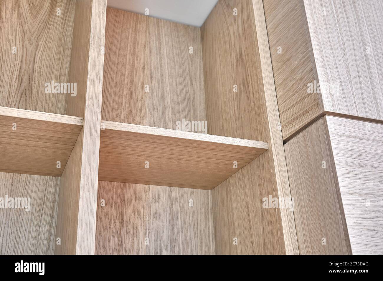 Wooden bookshelves. Wooden bookcases and wall panels made of oak