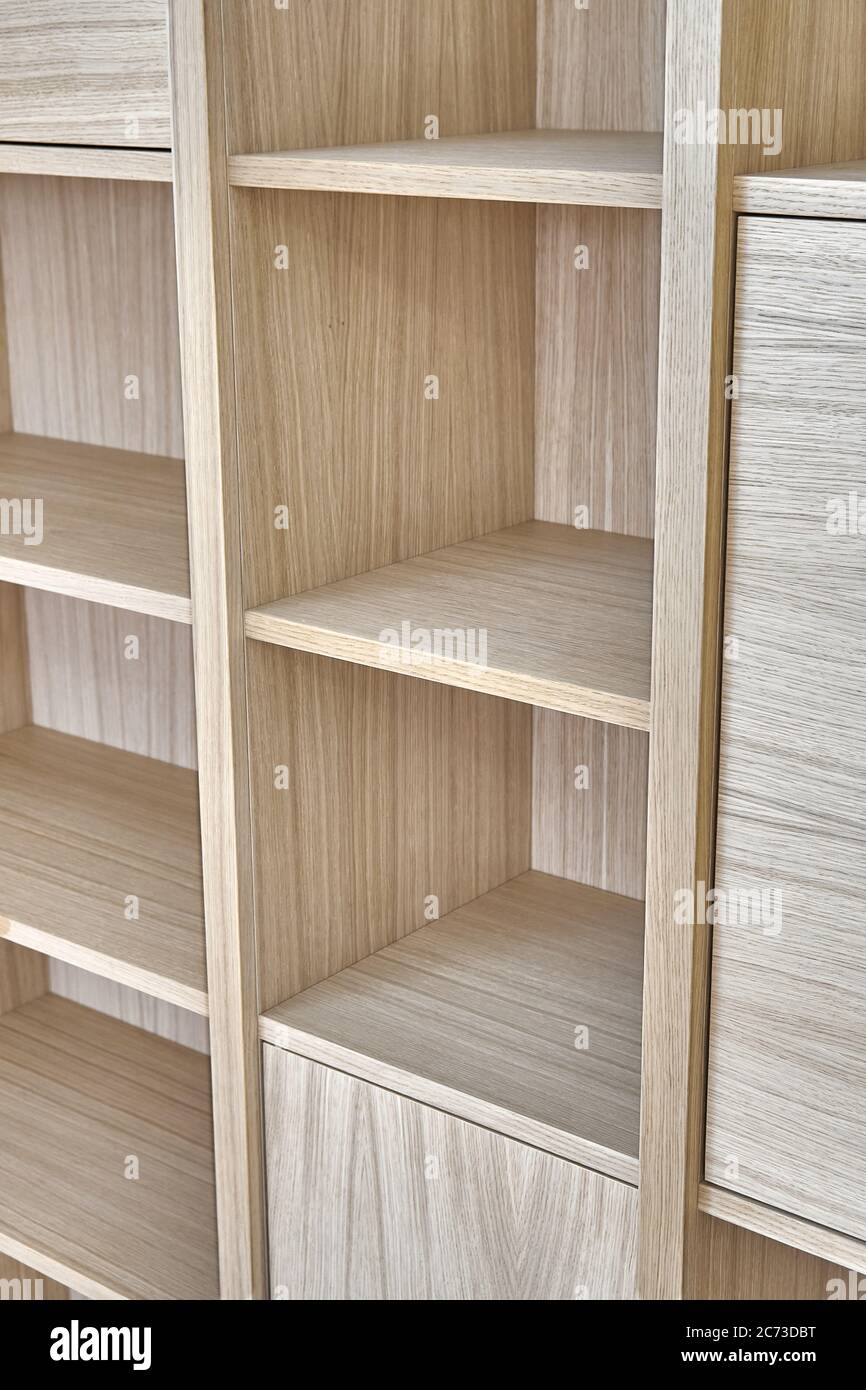 Wooden bookshelves. Wooden bookcases and wall panels made of oak