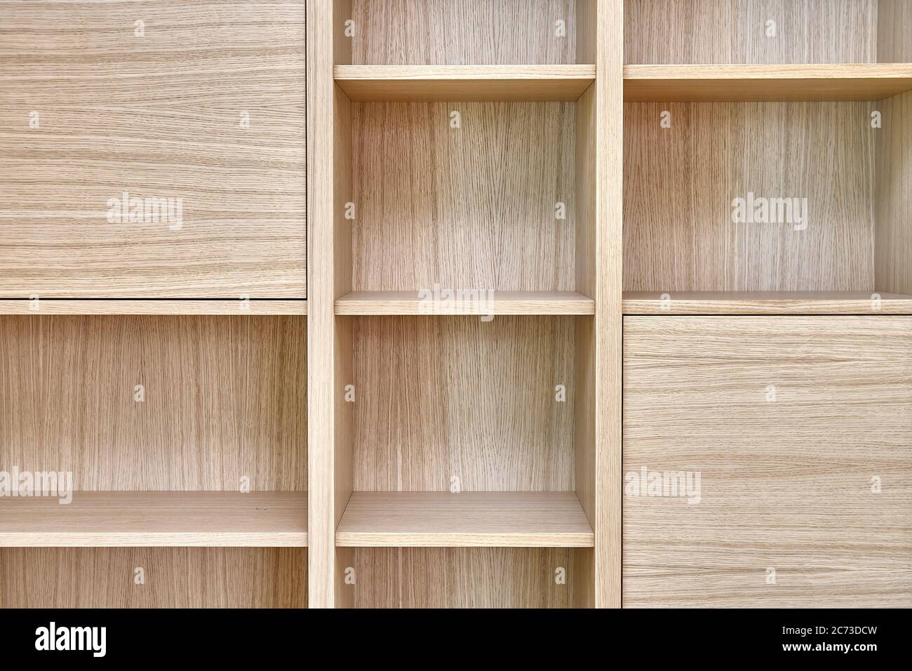 Wooden bookshelves. Wooden bookcases and wall panels made of oak