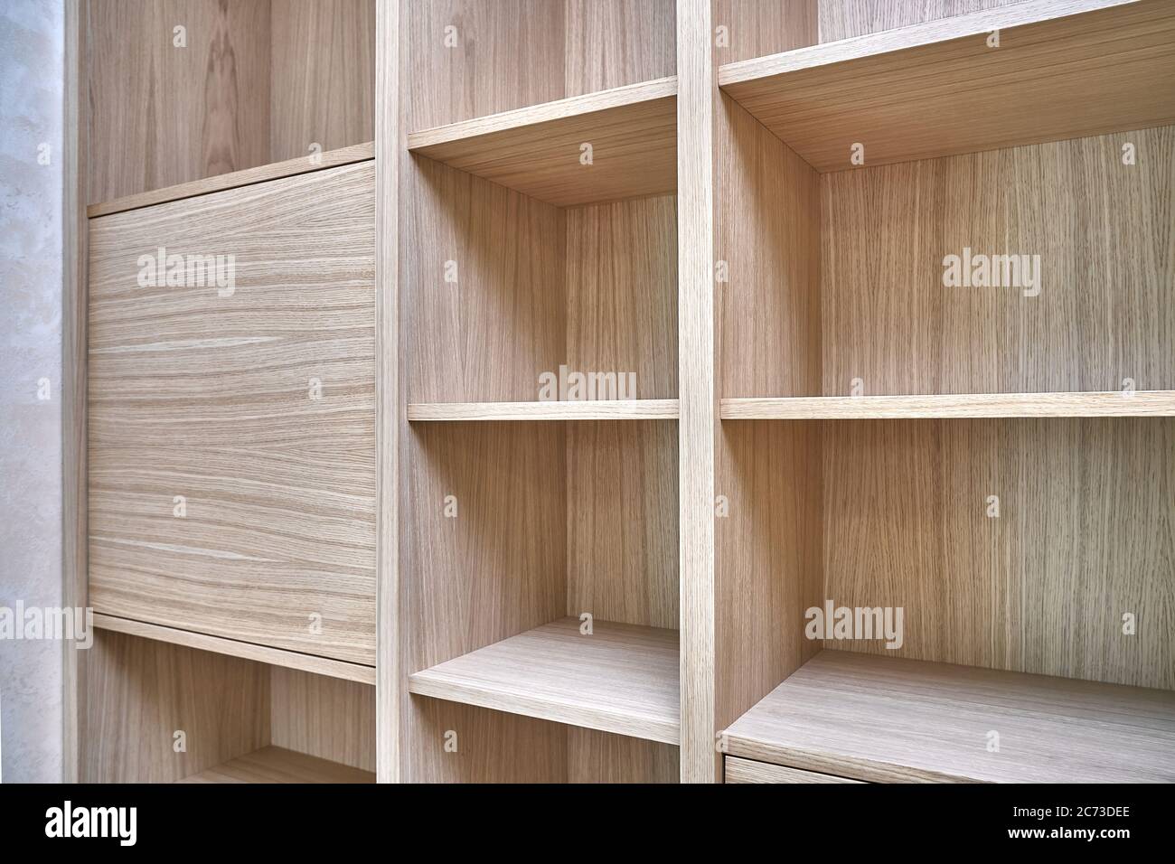 Wooden bookshelves. Wooden bookcases and wall panels made of oak