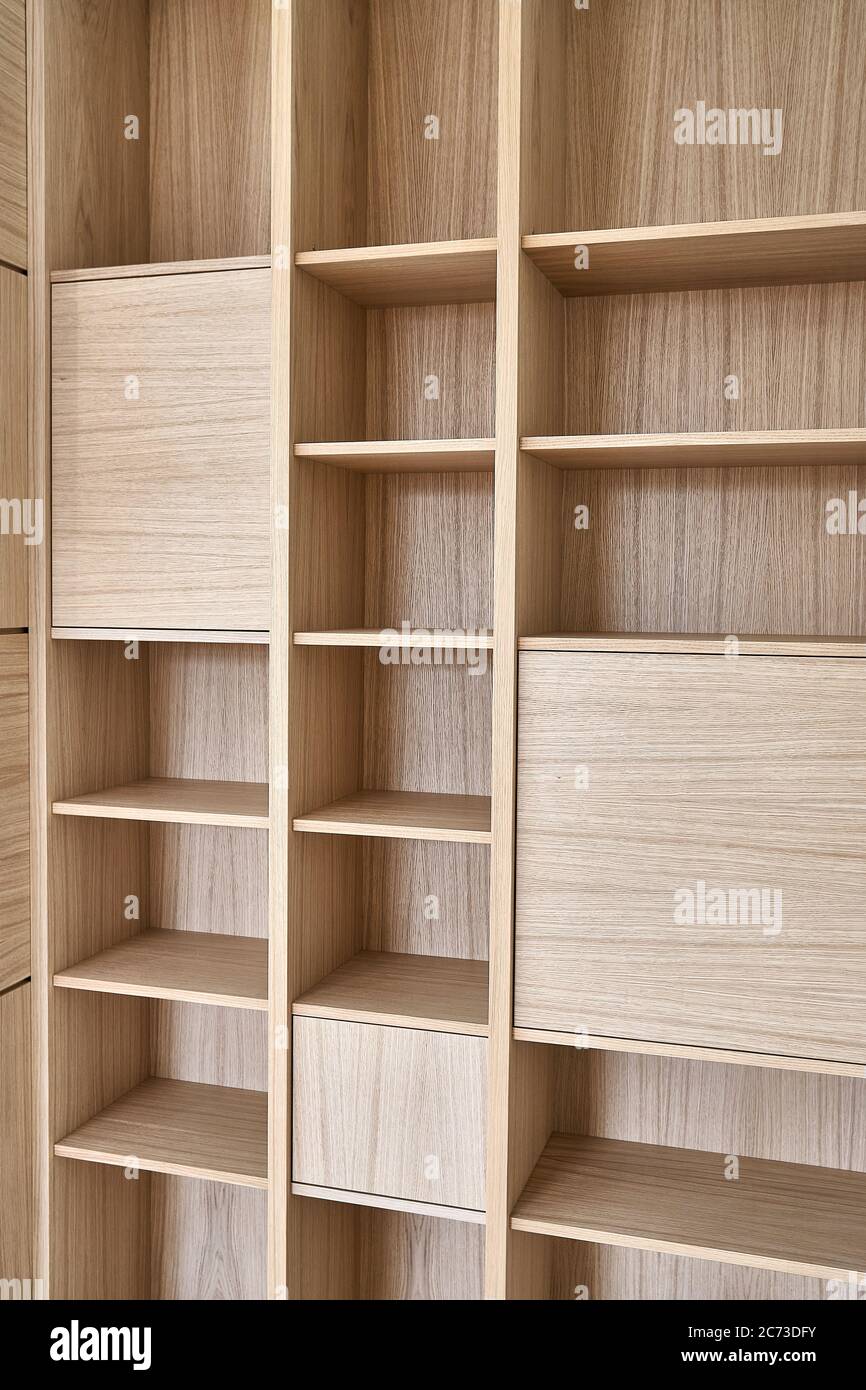 Wooden bookshelves. Wooden bookcases and wall panels made of oak