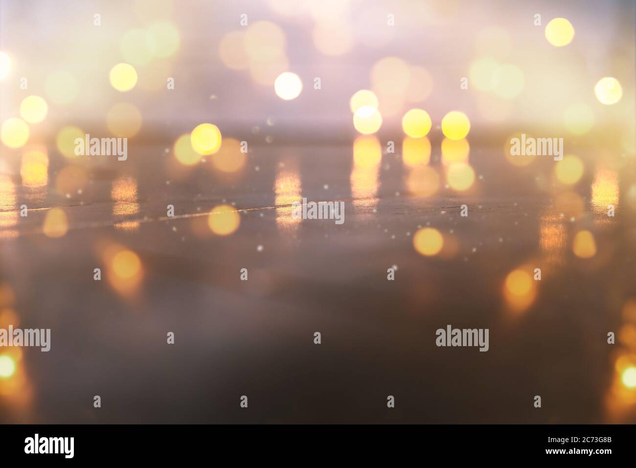 Empty rustic wooden table with blurred Christmas lights at background ...