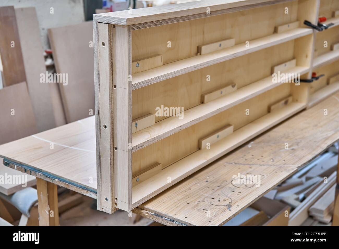 Joinery. Plywood desk. Veneered plywood countertop manufacturing process in workshop. Furniture manufacturing Stock Photo