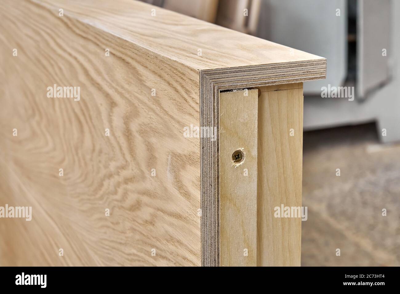 Joinery. Plywood desk. Veneered plywood countertop manufacturing process in workshop. Furniture manufacturing Stock Photo