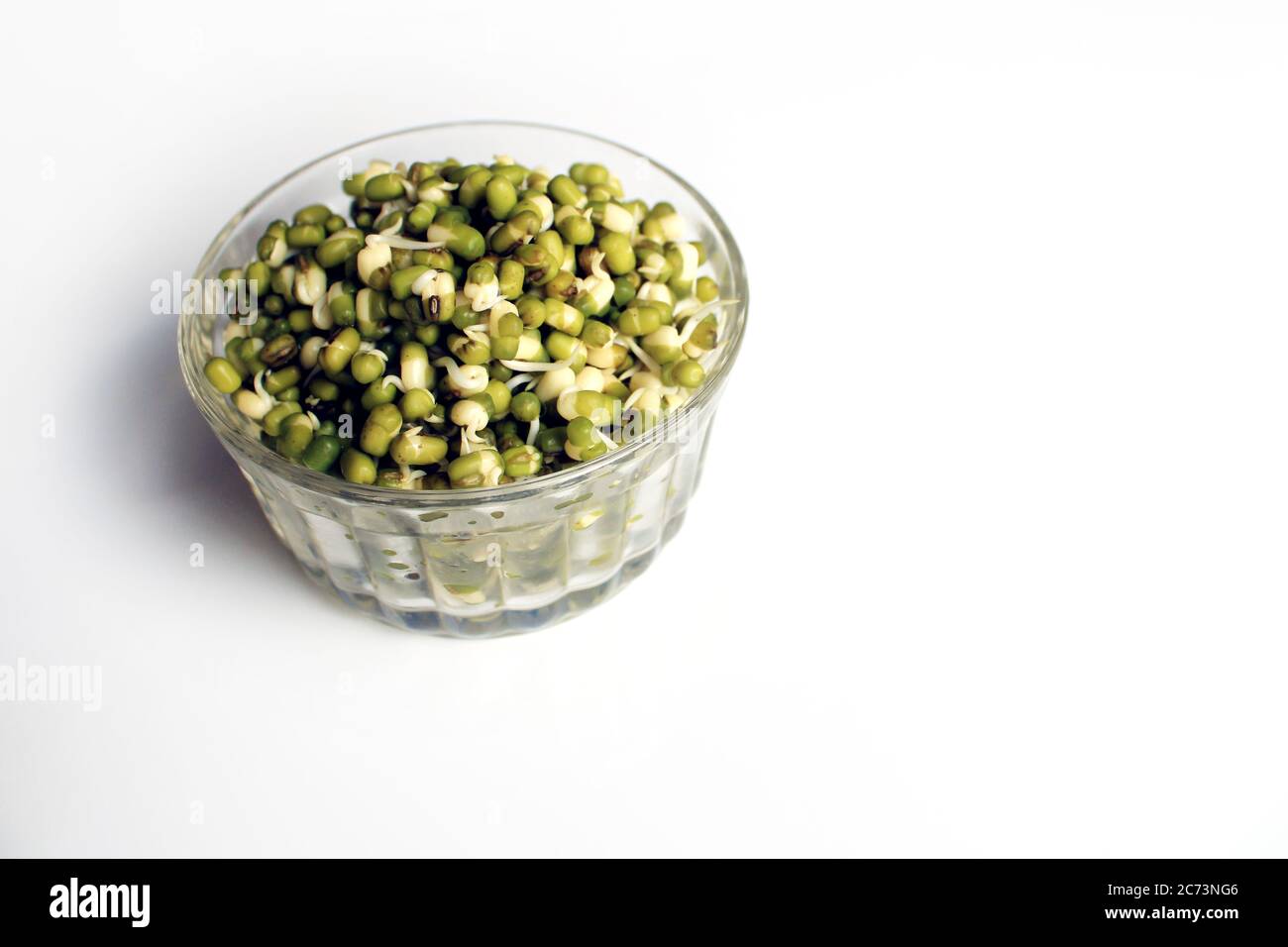 Sprouted green gram isolated with white background. Fresh, healthy sprouted mung dal or moong beans. Stock Photo