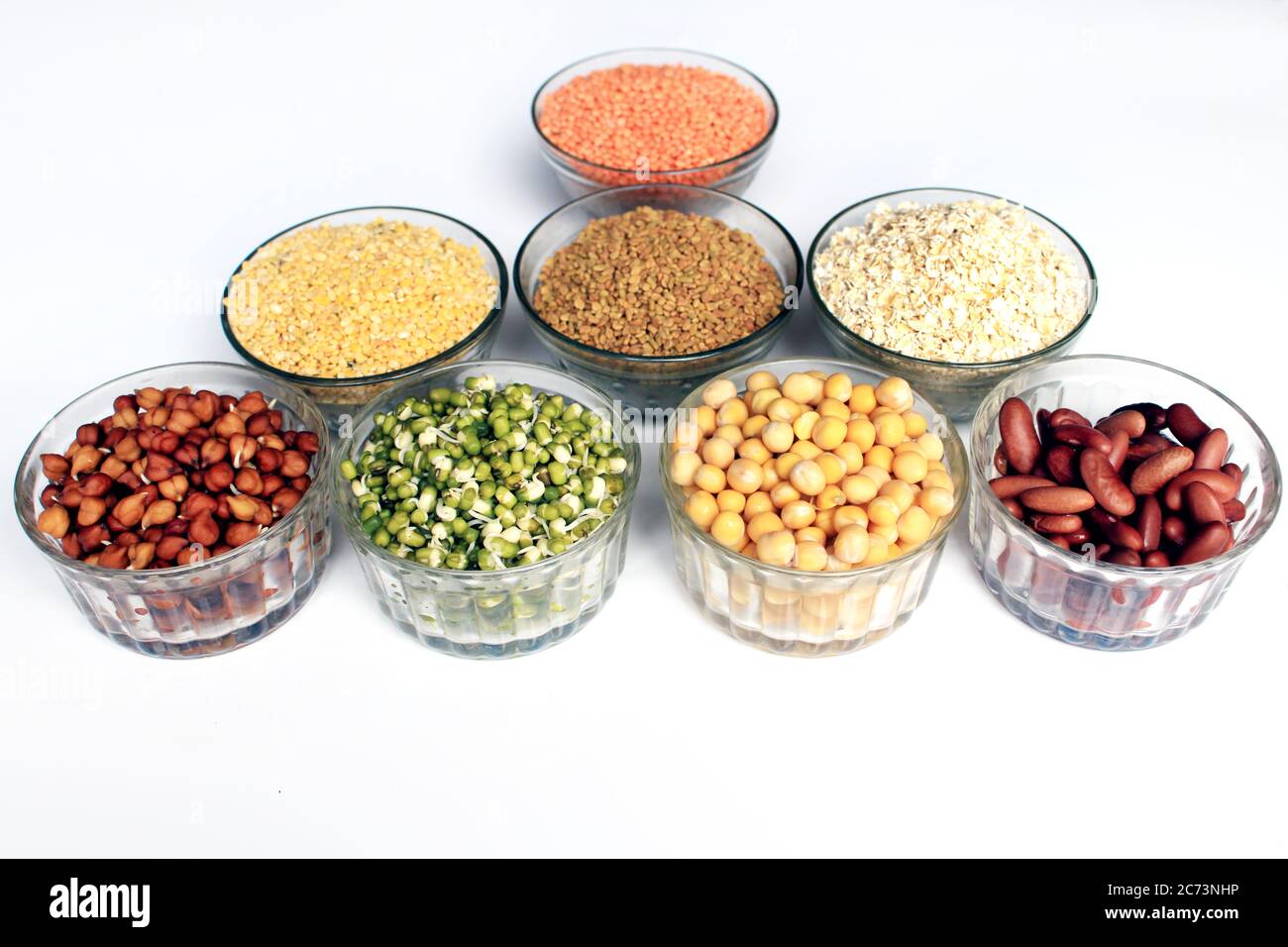 Collection of legumes (chickpeas, green peas, Pink lentils, red beans, green mung beans, Dry peas, Pigeon Peas, Red Kidney, Fenugreek seed, oatmeal) Stock Photo