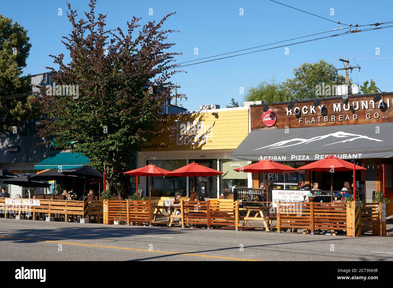 Vancouver, Canada. July13, 2020. Restaurants on Main Street expand seating  areas onto streets in order to accommodate more outdoor dining during the  COVID-19 global pandemic Stock Photo - Alamy