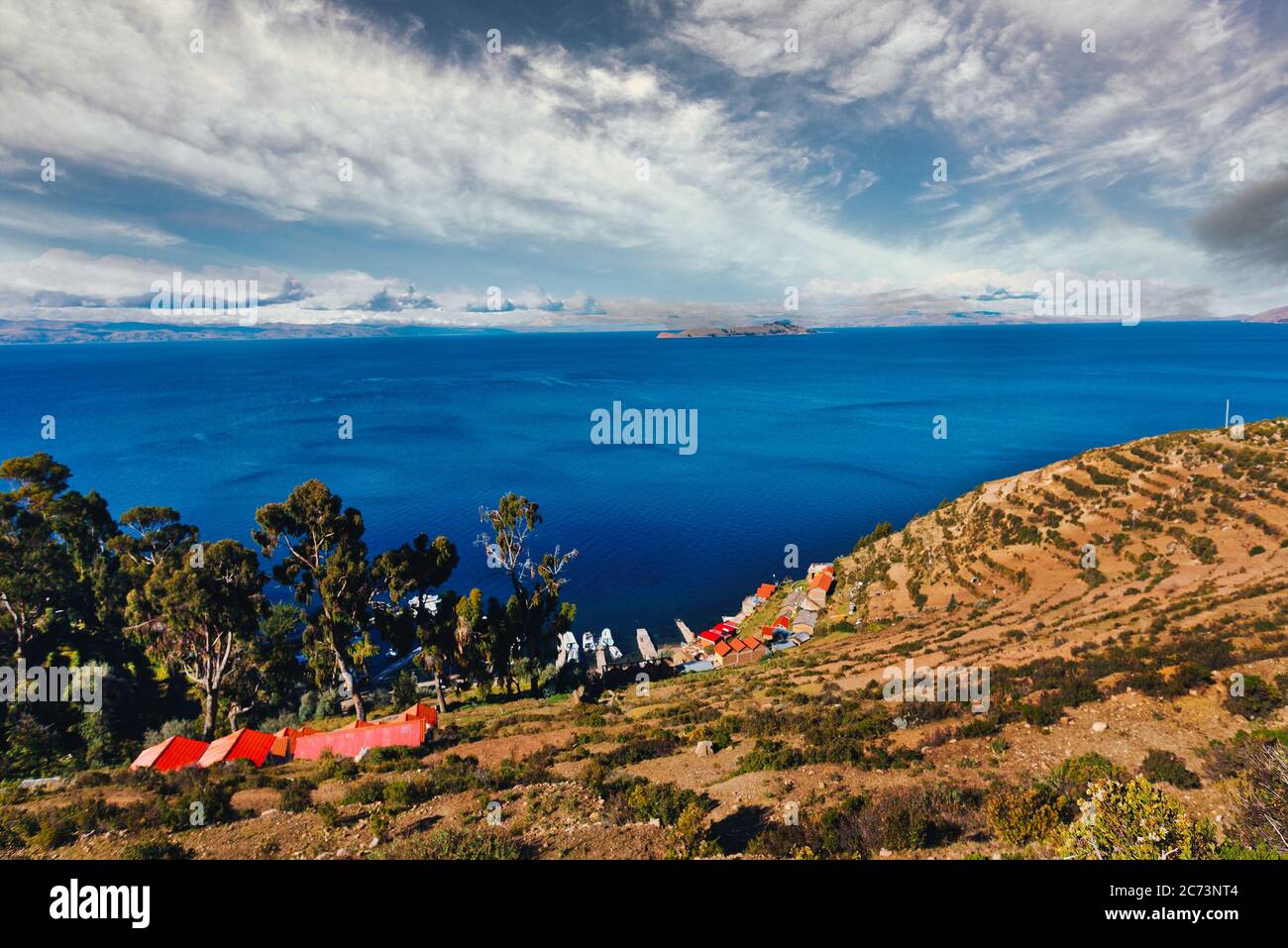 View of the Titicaca Lake on the border of Peru and Bolivia. By volume of water, it is the largest lake in South America.It is often called the highes Stock Photo