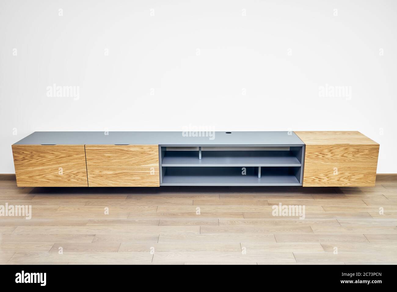 Contemporary floating media in living room. Wall mounted wooden