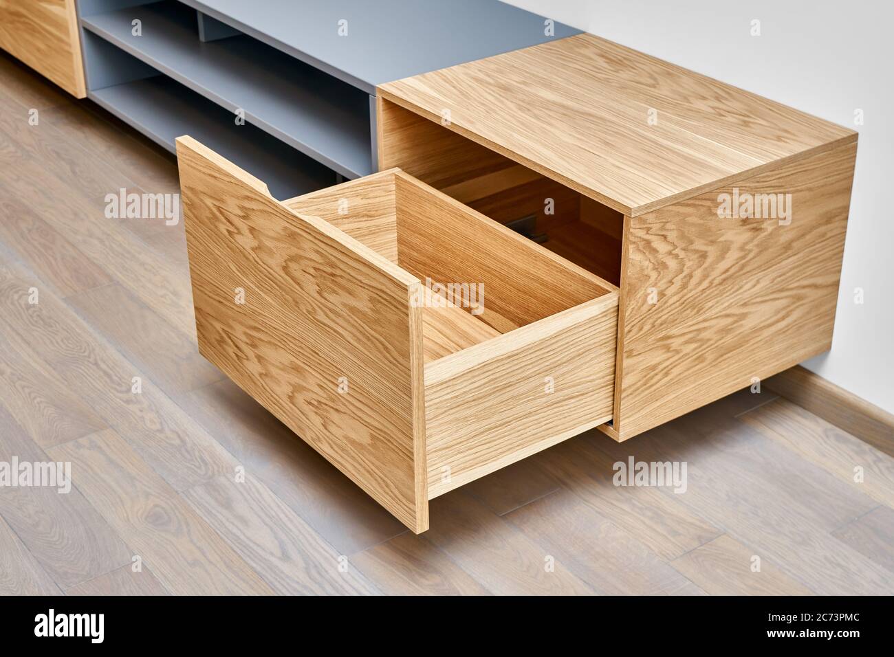 Contemporary floating media in living room. Wall mounted wooden