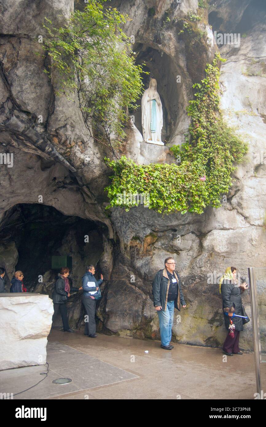 Apr 28. 2014 Lourdes France A faithful touch on the Massabielle Cave's ...
