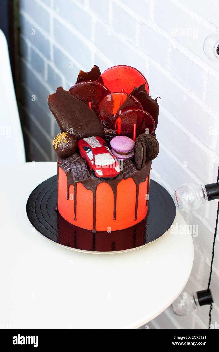 Red Cake With Chocolate Racing Car Chocolate Decoration Macaroons Lollipops And Cookies White Background Stock Photo Alamy Red Cake With Chocolate Racing Car Chocolate Decoration Macaroons Lollipops And Cookies White Background Stock Photo Alamy