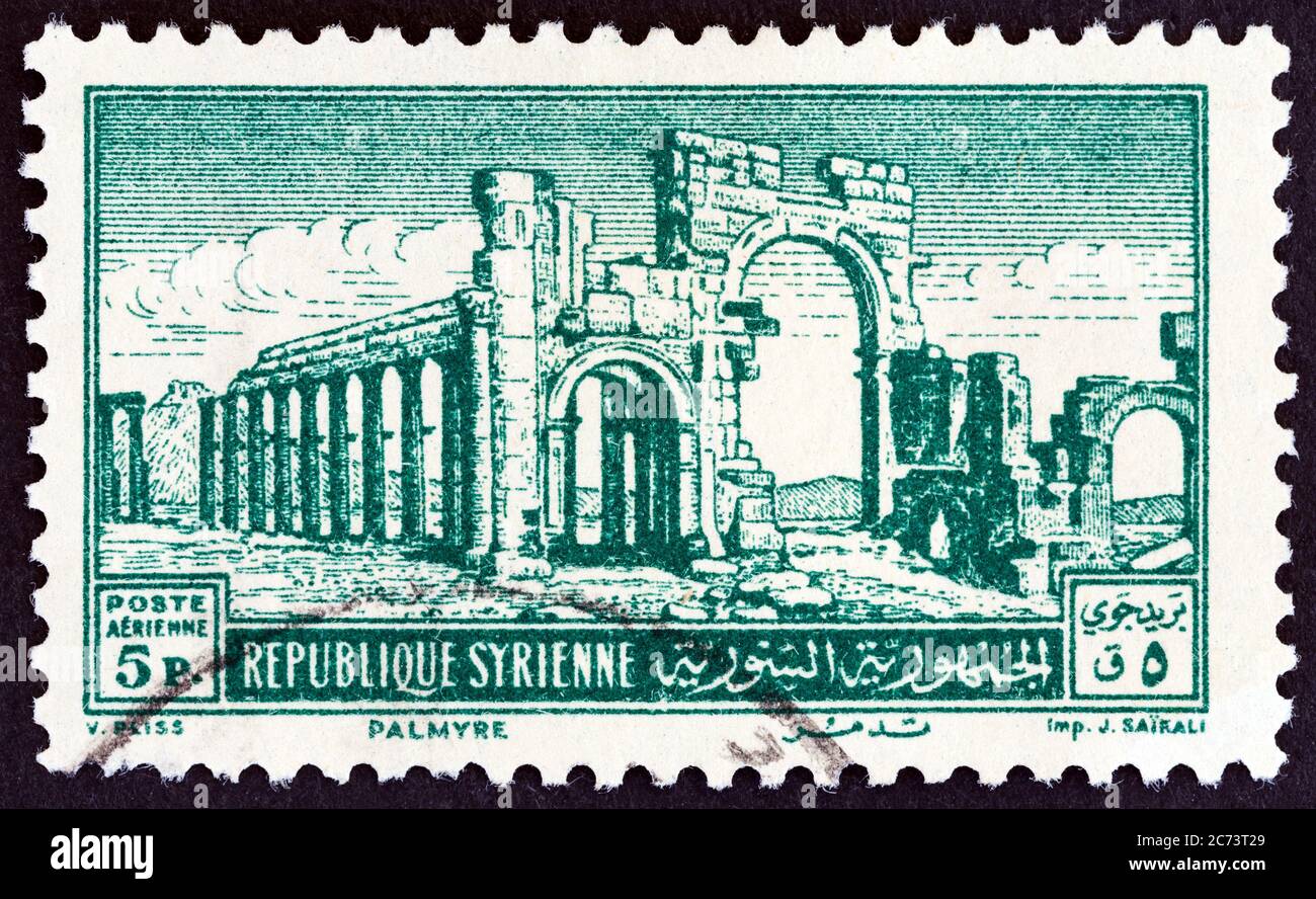 SYRIA - CIRCA 1952: A stamp printed in Syria shows the Monumental Arch, Palmyra, circa 1952. Stock Photo