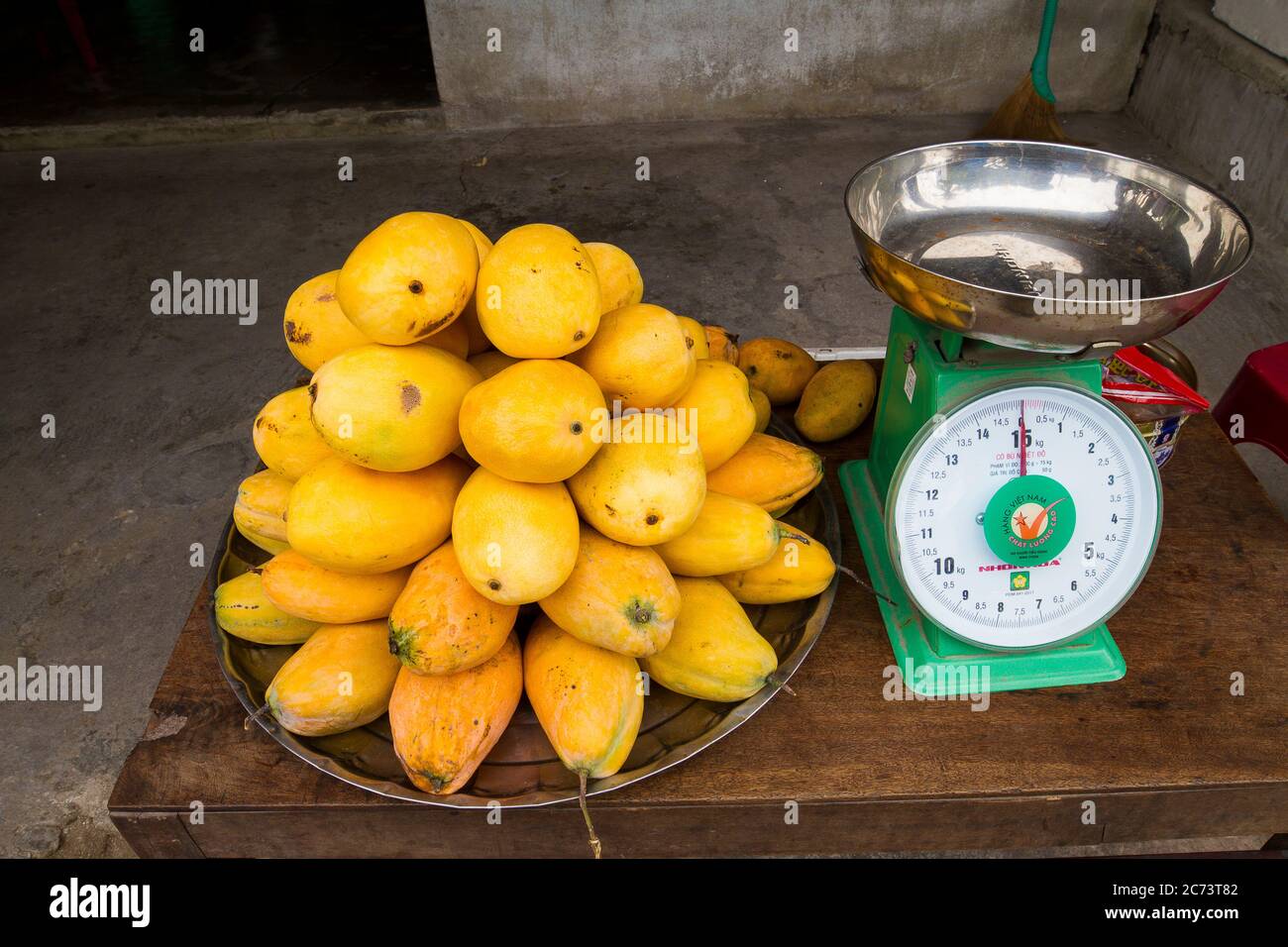 Mango and traditional scale in Vietnam. Streetmarket in Vietnam Stock