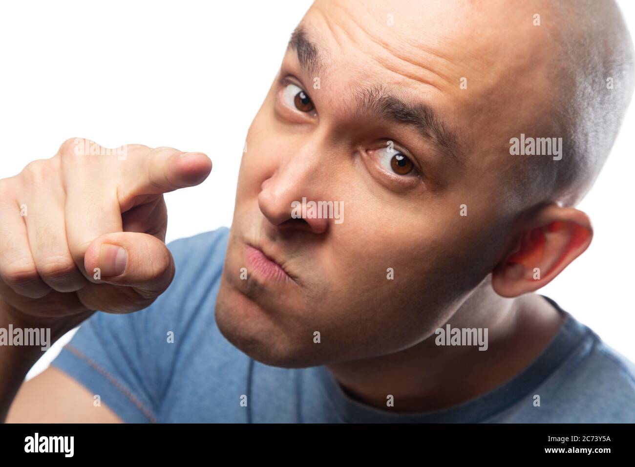 Image of young bald threatening pointing man Stock Photo