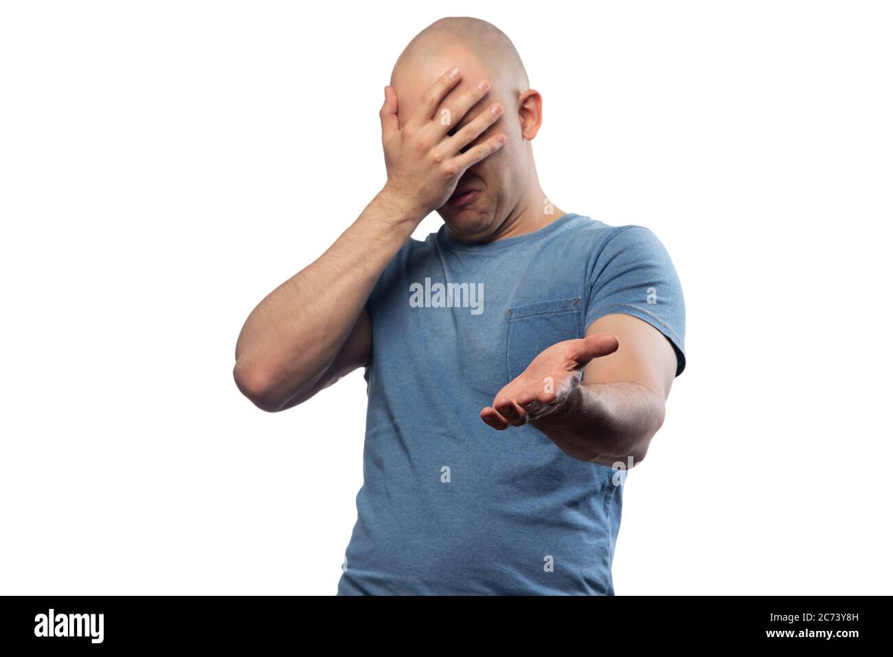 Photo of bald puzzled man in tee shirt showing facepalm gesture Stock Photo