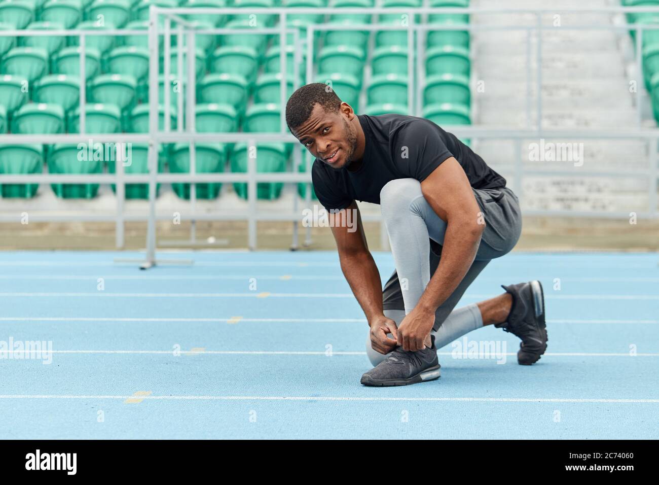 handsome african man preparing to run, full length photo. copy space.preparation for workout Stock Photo