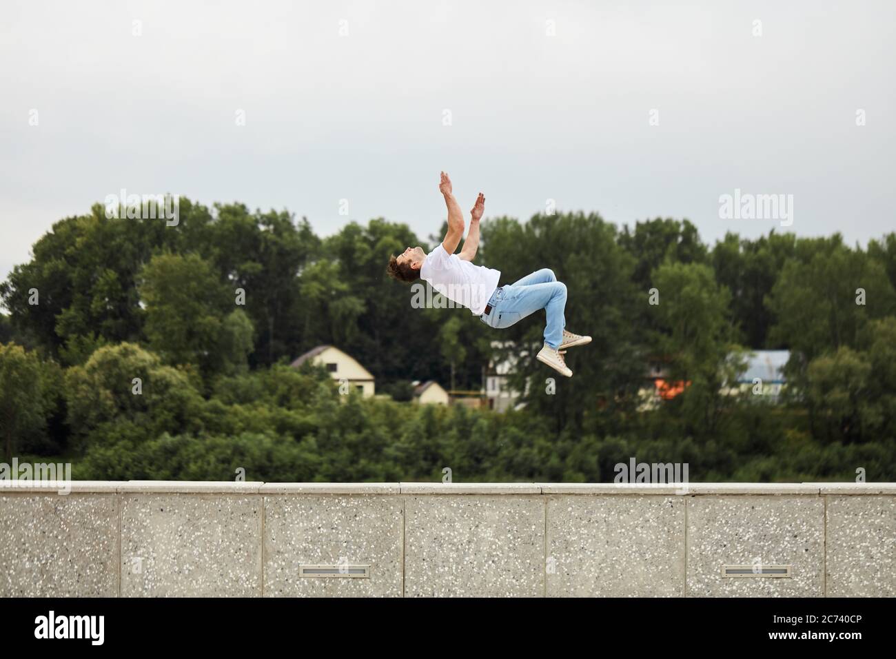 sportsman doing a stunt in the air.gravity. weightlessness. full length side view photo Stock Photo